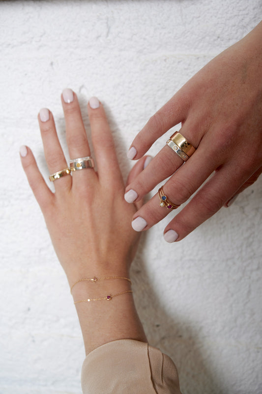 "Liquid Metal" Sterling Silver with 14K Gold narrow Hammered Band with Seven Diamonds