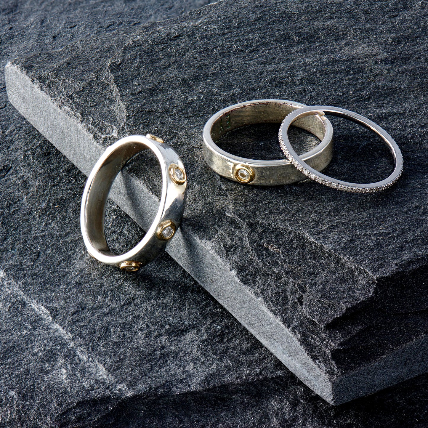 "Liquid Metal" 14K Gold narrow Hammered Band with Seven Diamonds