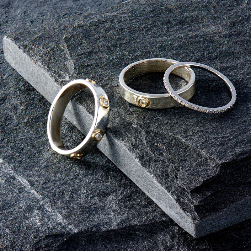 "Liquid Metal" Sterling Silver with 14K Gold narrow Hammered Band with Seven Diamonds