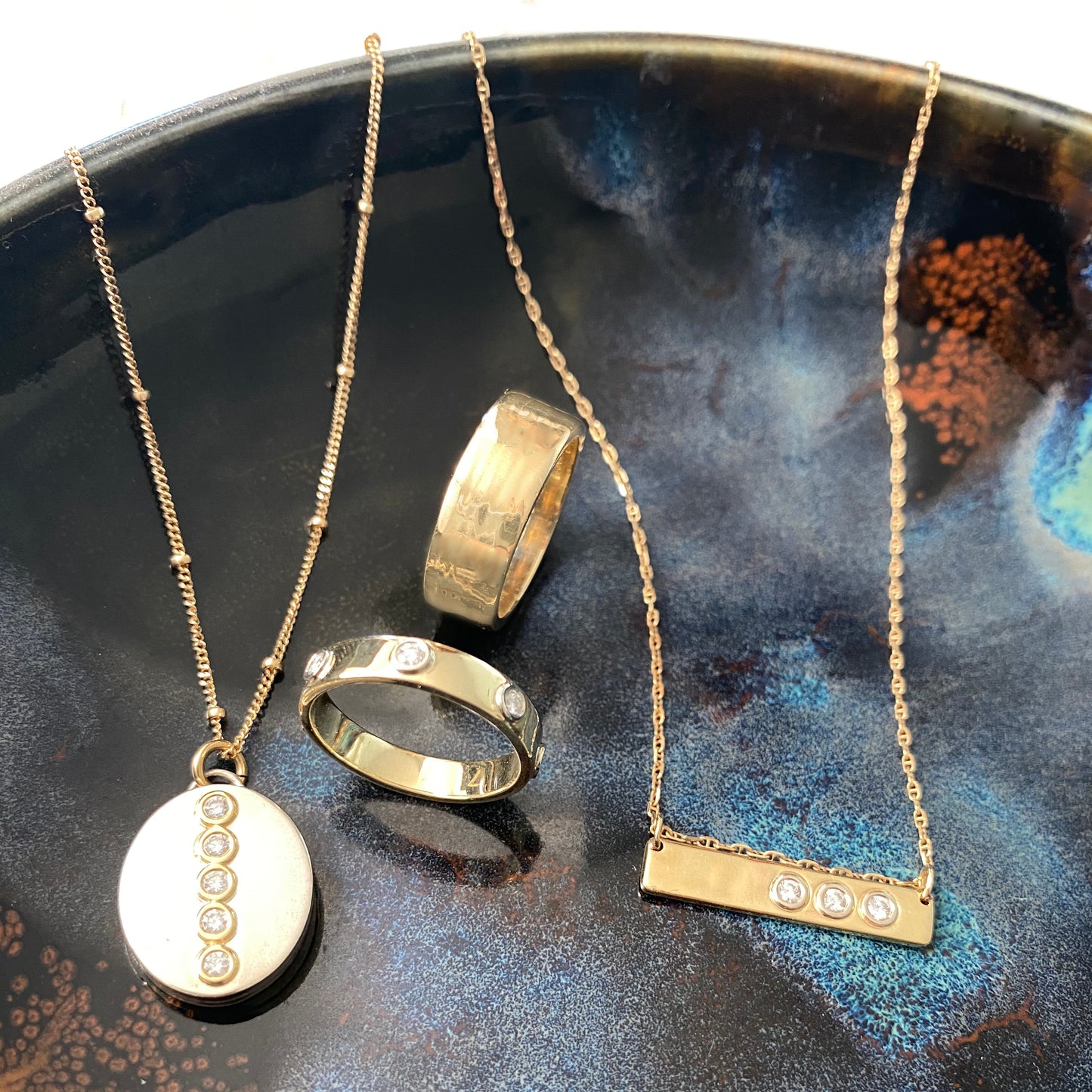 "Liquid Metal" 14K Gold narrow Hammered Band with Seven Diamonds