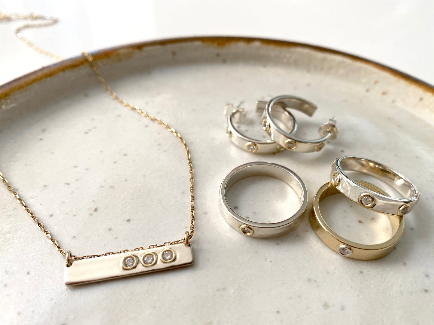 "Liquid Metal" 14K Gold narrow Hammered Band with Seven Diamonds